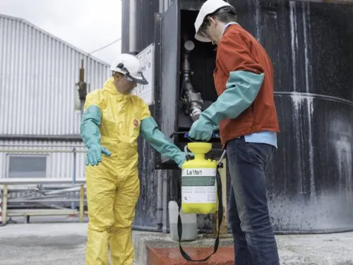 two employees using LeVert chemical decontaminant to prevent employee contamination